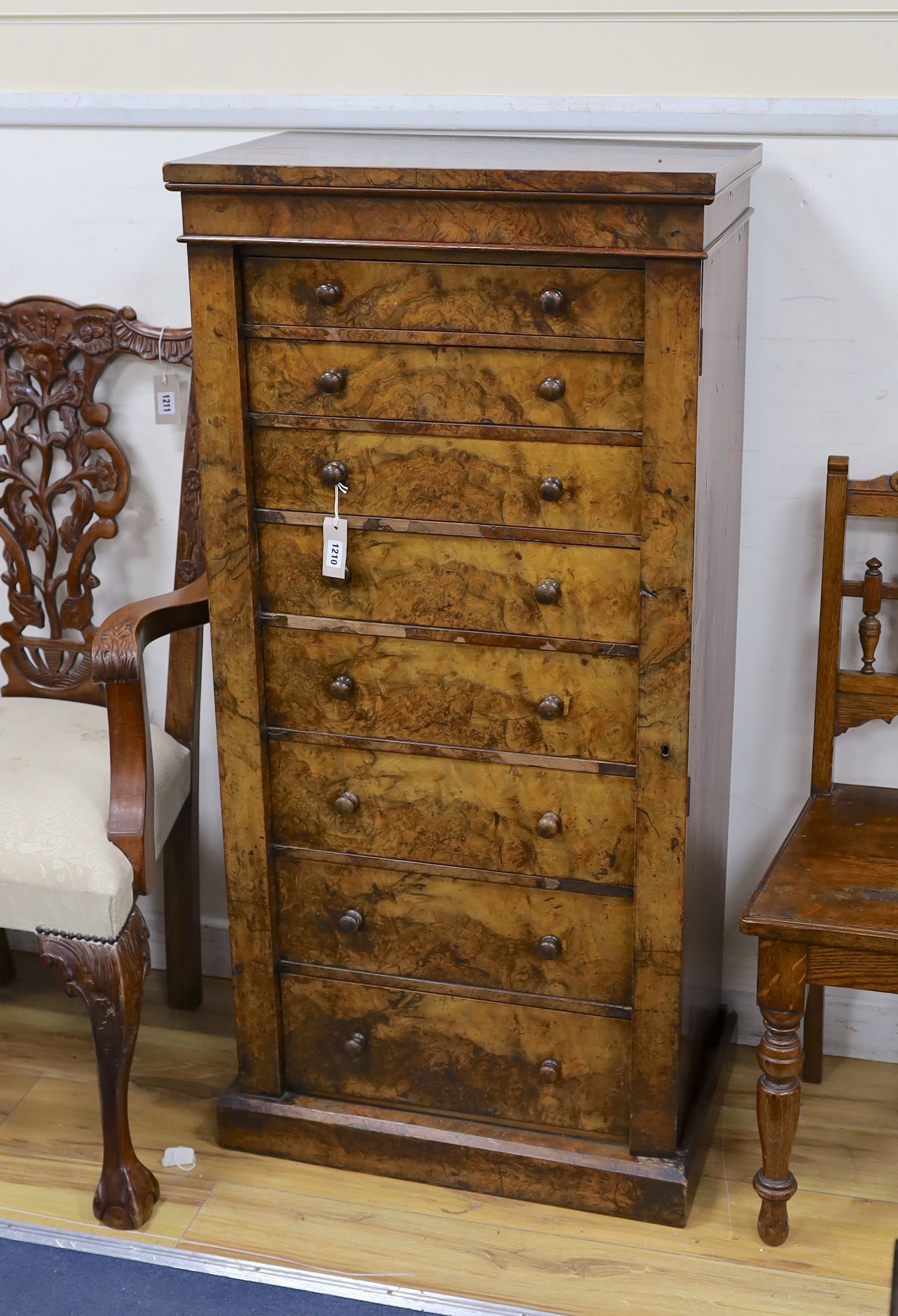 A Victorian figured walnut eight drawer Wellington chest with single locking bar, width 61cm, depth 40cm, height 128cm